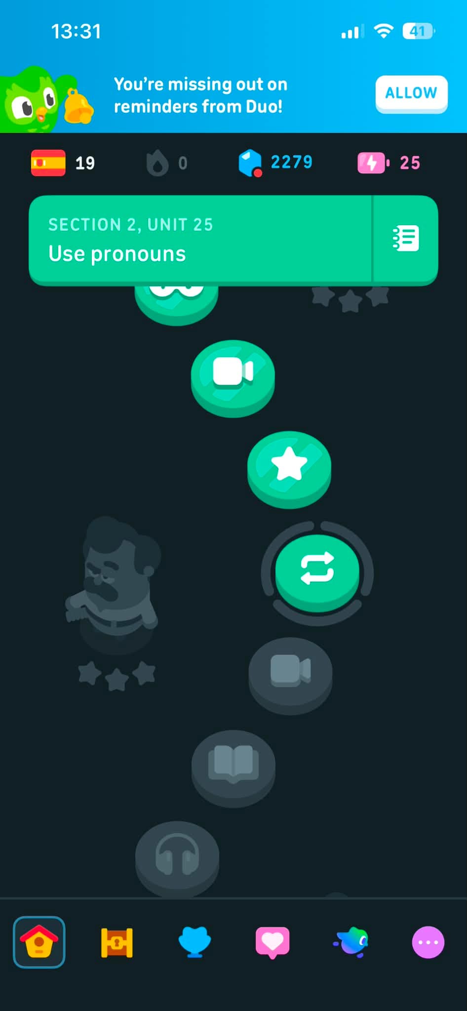 The Duolingo Spanish skill tree showing Section 2, Unit 25, focused on using pronouns, with lesson icons for practice, listening, and stories